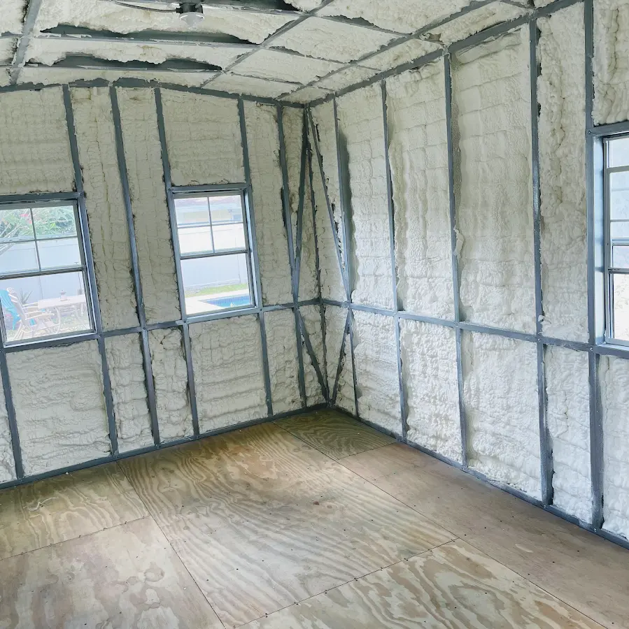 Closed-cell spray foam insulation applied to wall cavities in a residential project in Cold Spring